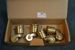 Four Brass Furniture Castors