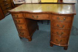 Serpentine Front Leather Topped Desk