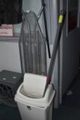 Ironing Board, Flip Top Bin, and a Mop