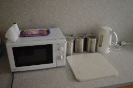*Microwave, Kettle, Canisters, and a Chopping Board