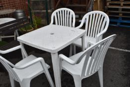 White Plastic Garden Table with Four Chairs