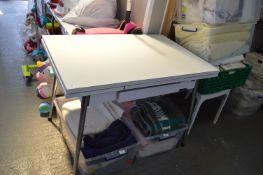 Foldout Kitchen Table with White Formica Top, Foldout Leaves, and Central Drawer 70x105cm x 76cm