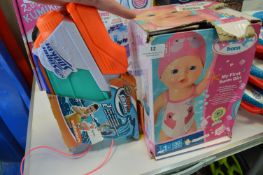Super Soaker Water Pistol, and a Baby Born My First Swim Girl Doll