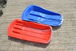 Two Snow Sleds
