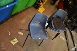 *Four Blue Plastic Chairs and One Cushion