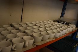 Contents of Shelf to Include Assorted Cups, Teapot