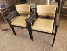 Eight Stackable White Leatherette Chairs