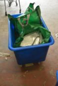 *Blue Plastic Laundry Basket and Three Bags of Assorted Tablecloths
