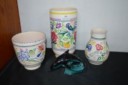 Three Poole Pottery Vases and a Dolphin