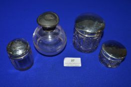 Four Silver Topped Glass Jars, 43g total (all lids have dents)