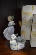 Two Nao Figurines of a Girl with Two Puppies
