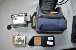 JVC Digicam, and a Panasonic Lumix Digital Camera