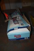 Box Containing Work Lights, Boots, Mitre Saw, and