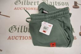 *Puma Light Green Joggers Size: M