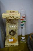Oil Lamp and a Glass Thermometer