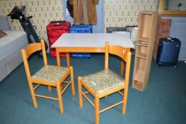 Kitchen Table, Two Chairs, and a CD Rack