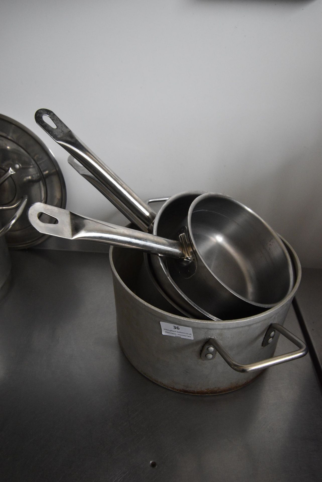 *One Aluminium Pan, and Three Stainless Steel Saucepans