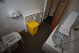 *Contents of Bathroom to Include Bath Lift Chair, Yellow Wastebin, and Toilet Riser