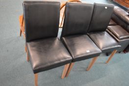 Three Faux Leather Dining Chairs