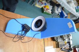 Two Plastic Shelf Brackets and a LED Alarm Clock