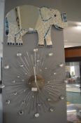 Metallic Wall Clock and an Elephant Mirror