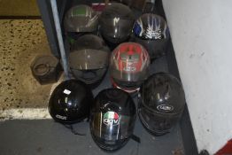 *Eight Used Motorcycle Helmets