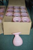 Twelve Pink Glass Vases