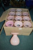 Twelve Pink Glass Vases
