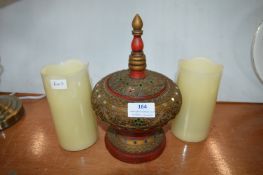 Two Artificial Candles and an Eastern Pot