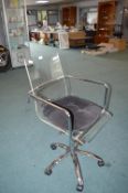 Metal Framed Swivel Chair with Perspex Seat