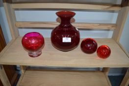 Red Glass Paperweights and Vases