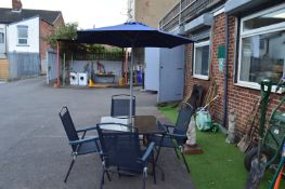Patio with Four Folding Chairs, and Parasol