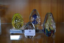 Four Glass Paperweights