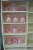 Twelve Pink Glass Vases