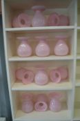 Twelve Pink Glass Vases
