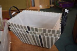 Three Fabric Covered Storage Baskets