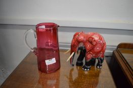 Cranberry Glass Jug, and an Elephant