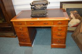 Small Mahogany Nine Drawer Writing Desk with Inset Leather Top