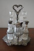 EPNS Condiment Stand and Assorted Glass Bottles Including Three with Hallmarked Silver Tops