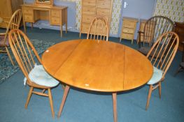 Ercol Oval Drop Leaf Dining Table with Three Ercol Bentwood Spindleback Chairs, and Two Similar