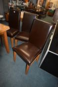 Six Leather Upholstered Highback Dining Chairs on Light Oak Legs (Chairs Only - Table Not Included)