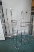 Two Chrome Shower Caddies and a Chrome Toilet Roll