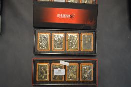 Two Sets of Four Earth Zippo Style Lighters