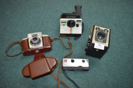 Vintage cameras by Kodak and Polaroid