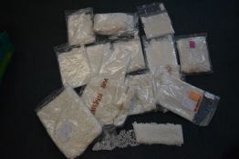 *Seventeen Packs of Ivory Lace Fabrics