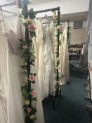 *Box of Artificial Foliage, and Artificial Foliage Attached to The Garment Rails (rails not