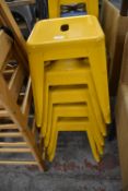 Five Yellow Painted Metal Stools