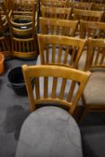 Seven Wooden Chairs with Grey Upholstered Seats