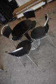 60cm Circular Black Pedestal Table with Four Stackable Black & Chrome Chairs