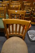 Seven Wooden Chairs with Light Brown Upholstered Seats